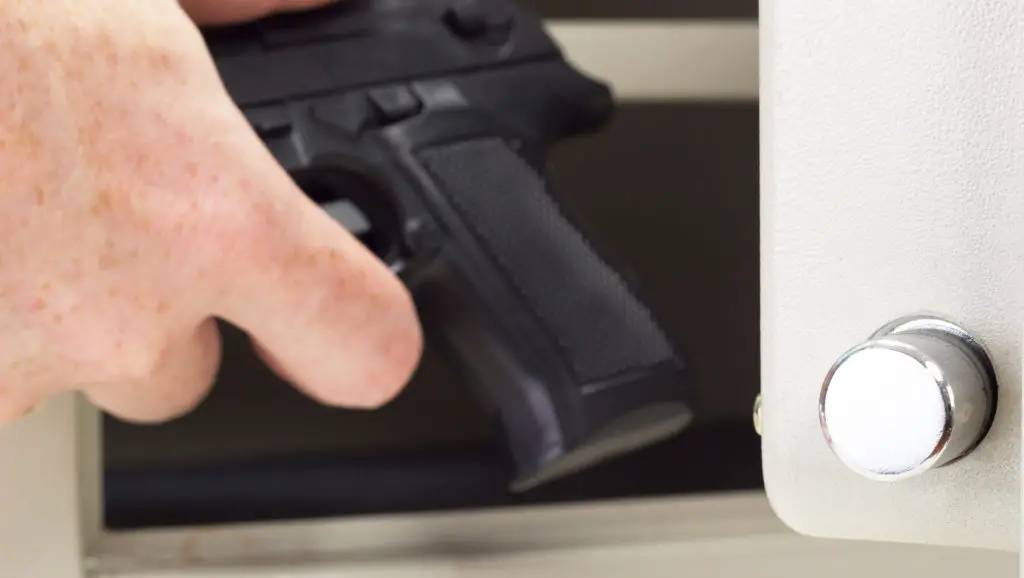 Putting a firearm in a gun safe